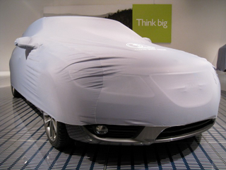 Illustration for article titled 2010 Saab 9-5 Wagon Teases In Slinky Car Cover